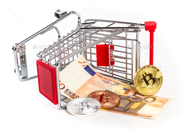 Bitcoins and fifty euro banknote in overturned shopping cart - Stock Photo - Images
