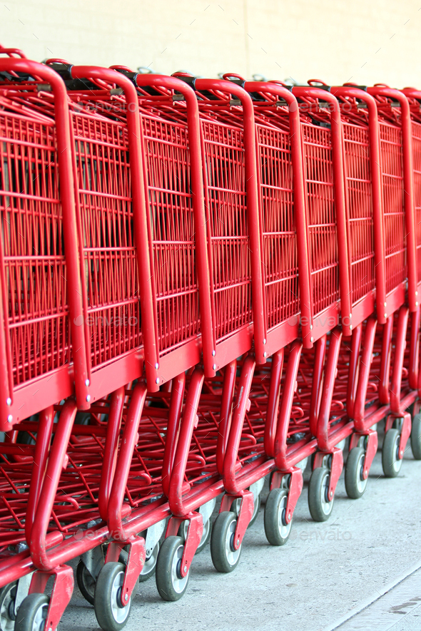 Row of red metal shopping carts