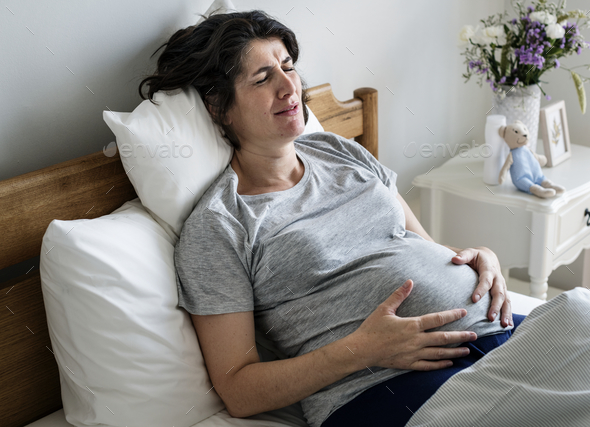 Pregnant woman with labor pain - Stock Photo - Images