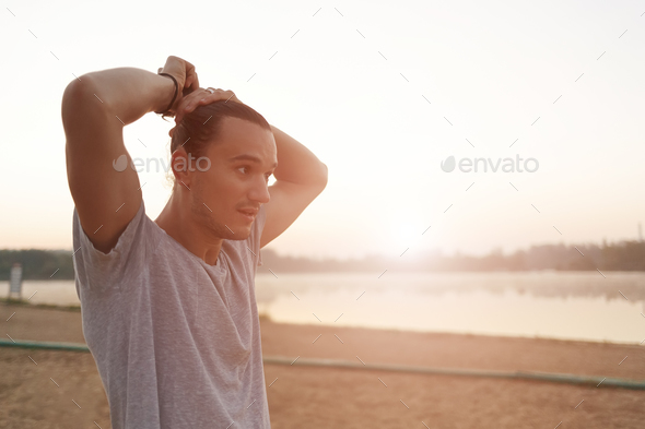Portrait of athletic positive capoeira man on city beach backgro - Stock Photo - Images