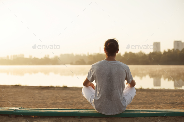 Shot of healthy young man taking a break after morning workout. - Stock Photo - Images