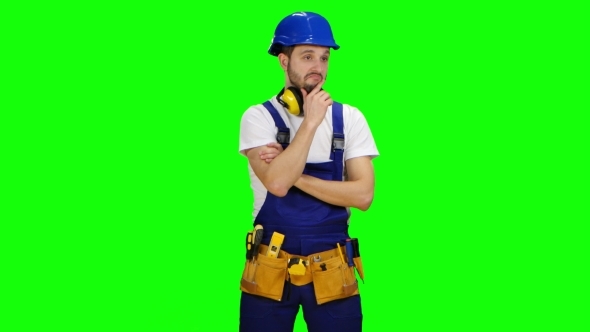 Builder Is Thinking How to Properly Draw a Sketch for Building a Building on Green Screen alt