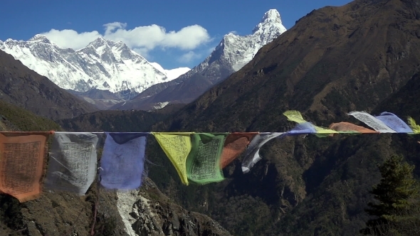 Tibetan Prayer Flags Against White Snowy Mountain Peak in the Everest Region of Himalayan Mountains