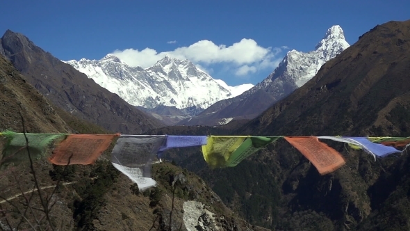 Tibetan Prayer Flags Against White Snowy Mountain Peak in the Everest Region of Himalayan Mountains