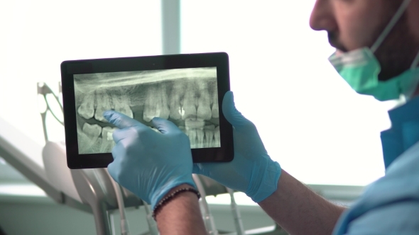 Dentist Shows X-ray on Tablet, Stock Footage | VideoHive