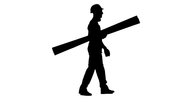 Silhouette of Builder in a Helmet Goes to Work with Wooden Boards in ...