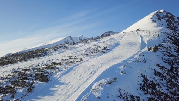Skiers on Ski Slope in High Tatras Mountains  alt