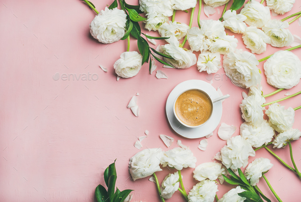 Flat-lay of cup of coffee and ranunculus flowers, top view - Stock Photo - Images