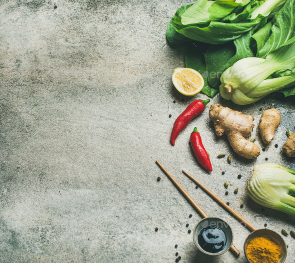 Flat-lay of Asian cuisine ingredients over grey concrete background - Stock Photo - Images