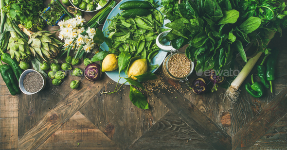 Spring healthy vegan food cooking ingredients, wooden background, wide composition - Stock Photo - Images