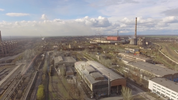 Aerial View of Industrial Steel Plant. Aerial Sleel Factory. Flying Over Smoke Steel Plant Pipes alt