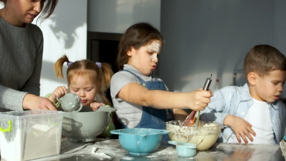 Children in the Kitchen The Girl Stirs the Dough and Watches It Flow From the Corolla alt