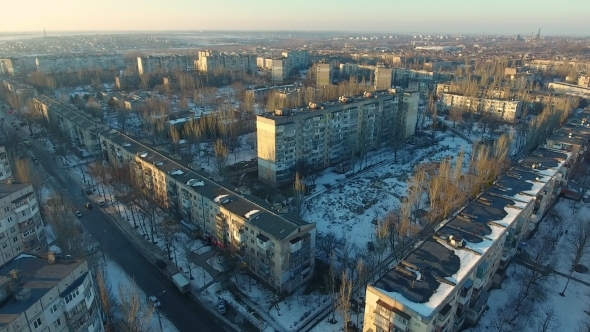 Aerial Shot of Eastern European City with High Buildings in Snowy Winter