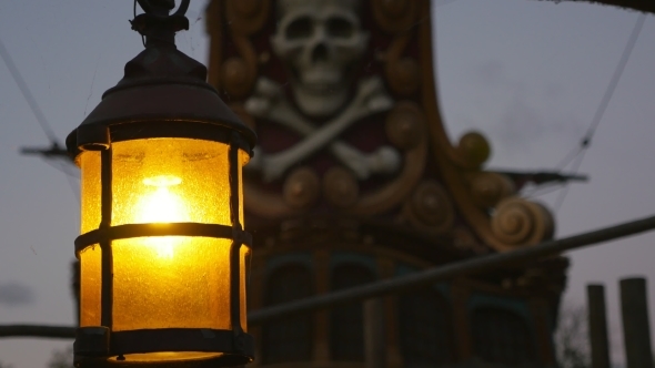 Antique Lantern Near a Skull and Bones Monument in Paris in the Twilights
