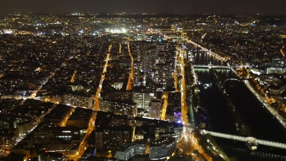 Aerial of Paris at Night with Shining Riverbanks of the Seine in Autumn