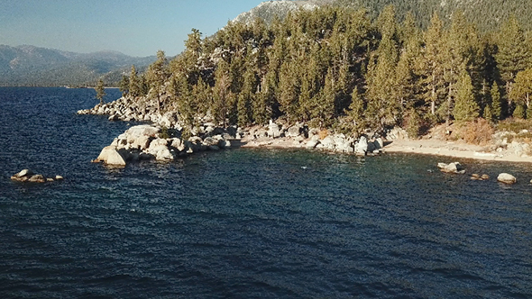 Flying Over Chimney Beach And Mountain