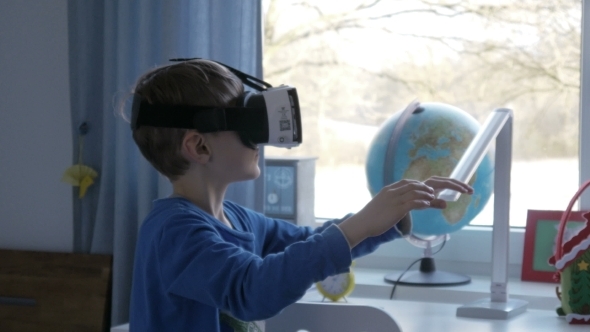 Boy in Virtual Reality Glasses Playing 360 Degree Game -