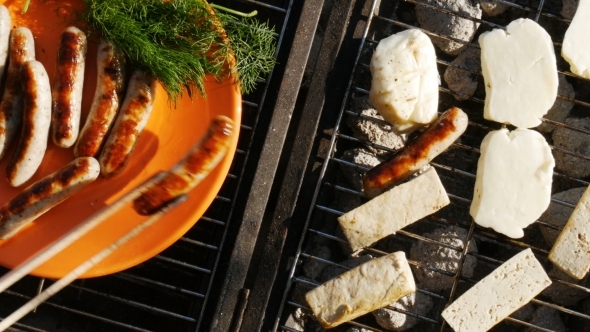 Barbecue -Grilling Sausages, Tofu and Cheese - Top View -