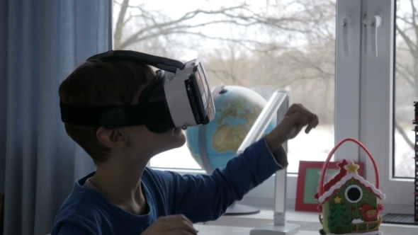 Little Boy Using Virtual Reality Glasses -