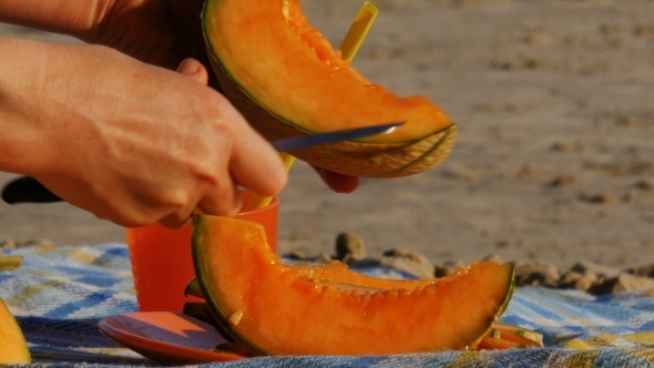 Picnic on a River Beach, Cutting Melon