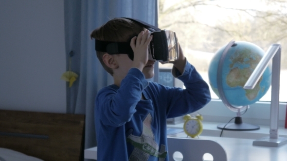 Boy in Virtual Reality Glasses Playing 360 Degree Game