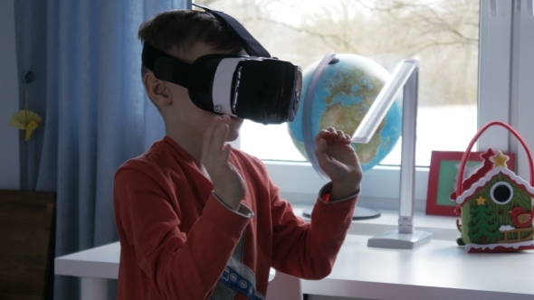 Boy in Virtual Reality Goggles Playing 360 Degree Game 