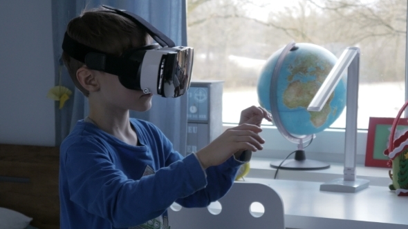 Boy in Virtual Reality Glasses Playing 360 Degree Game 