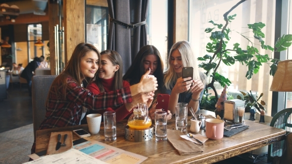 Four Beautiful Young Woman Doing Selfie in a Cafe, Best Friends Girls Together Having Fun
