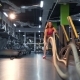 Girl Is Doing Exercises Using Sports Equipment Rope. Battle Rope Exercise at Gym - VideoHive Item for Sale