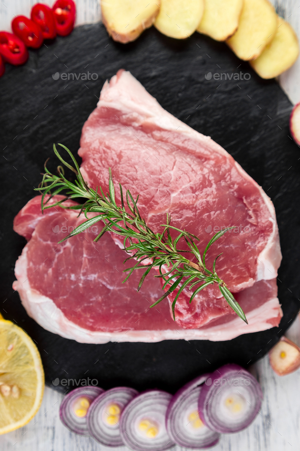 Raw pork meat with spice ingredient - Stock Photo - Images