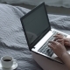 Positive Woman with Laptop Blogging on the Bed - VideoHive Item for Sale