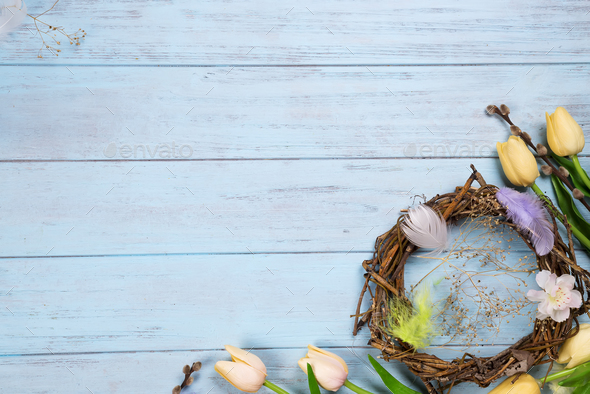 Easter nest and tulips on a wooden blue background Stock Photo by ...