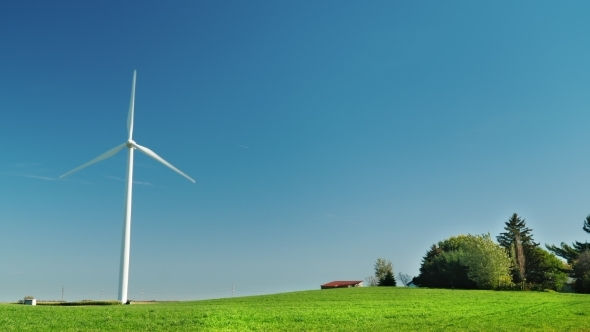 One Industrial Wind Generator on a Green Meadow. Alternative Sources of Clean Energy alt