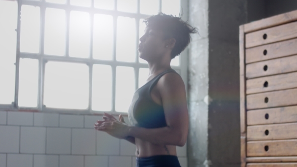 Young Fit and Tone Up Woman Doing Heating Before a Fitness Workout in Sunny Loft alt