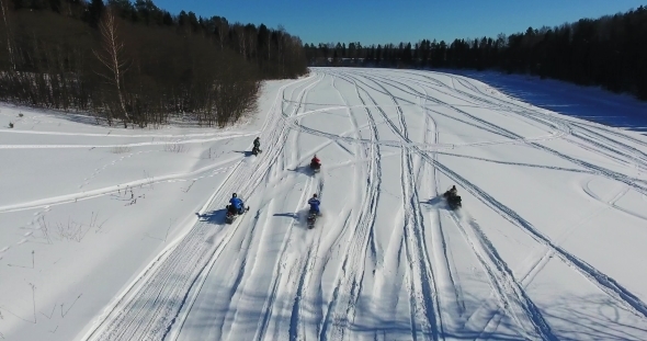 The Group on Snowmobiles