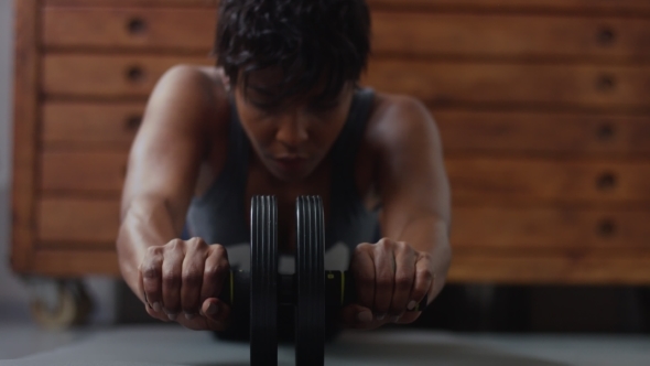 Young Fit and Tone Up Woman Doing Fitness Workout in Sunny Loft alt