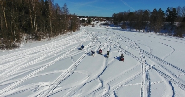 The Group on Snowmobiles