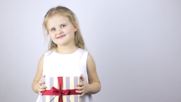 Happy Young Girl with a Gift Box