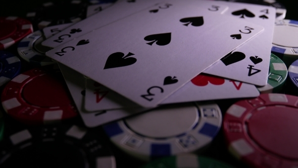 Poker Cards Fall Down on Poker Chips