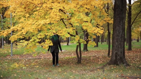 Funny Young Woman Is Jumping in the Park Full