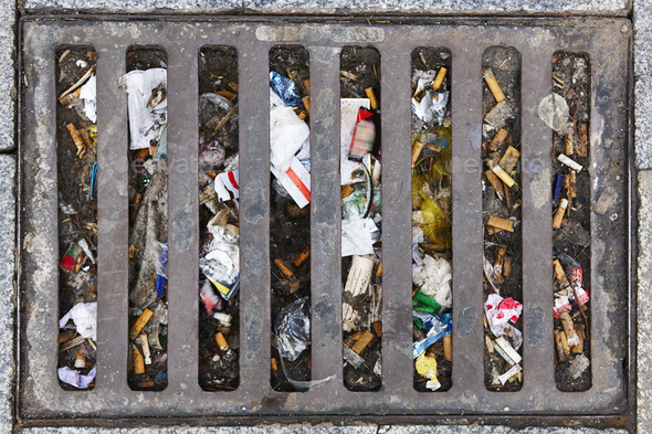 Sewer full of garbage. Urban pollution. Waste treatment. Clean cities - Stock Photo - Images