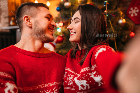 Love couple makes selfie, Christmas celebration - Stock Photo - Images