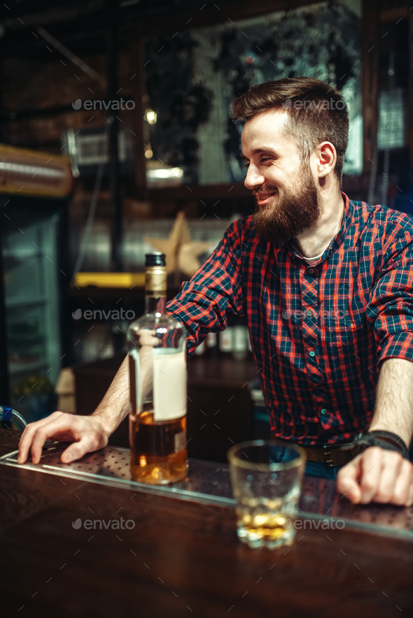 One man standing at the bar counter, drunkenness Stock Photo by NomadSoul1