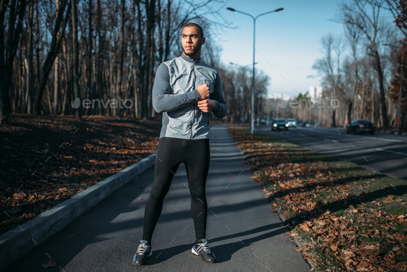 Male jogger in motion on workout outdoors - Stock Photo - Images