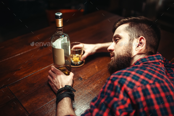 Drunk man sleeps at the bar counter, top view - Stock Photo - Images