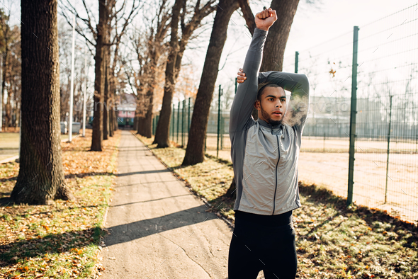 Male jogger on fitness workout in autumn park - Stock Photo - Images