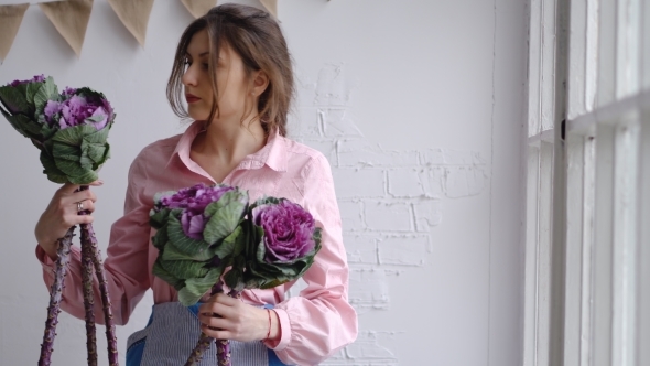 Girl Florist Selects the Best Flowers To Create a Bouquet - Ornamental Cabbage