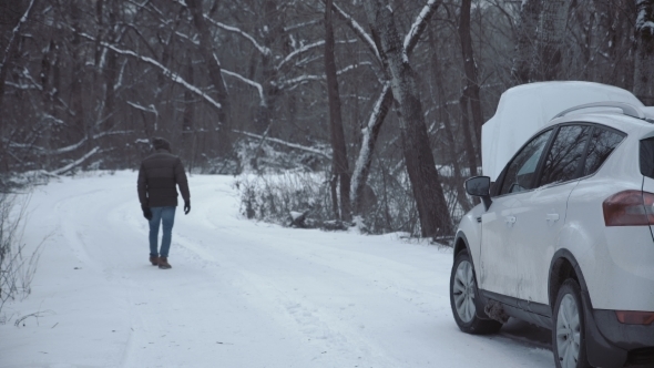 Man with Broken Car on Winter Road alt