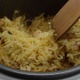 Cooking Basmati Rice In A Cooker With Carrot And Mixing With Wooden Spoon Shot On Red Camera - VideoHive Item for Sale