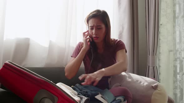 Woman serious checking before traveling the new normal travel need a face mask alt